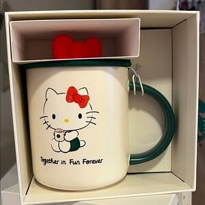 Starbucks Hello Kitty Cream Mug with Green  Handle